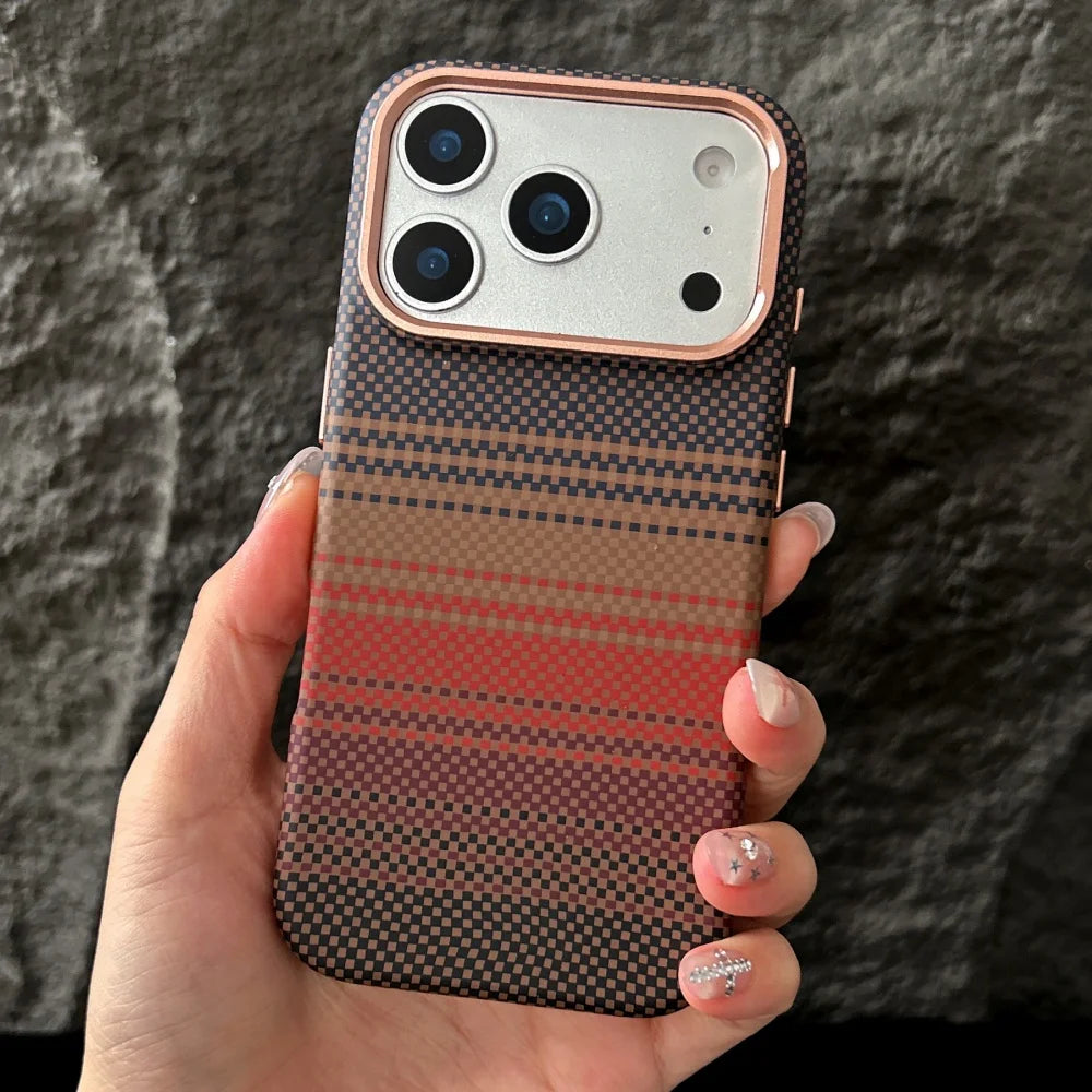 Phone case with a striped pattern held by a hand against a dark background