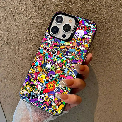 A hand holding a black iPhone case covered in a dense, colorful cartoon character print, set against a textured beige wall.