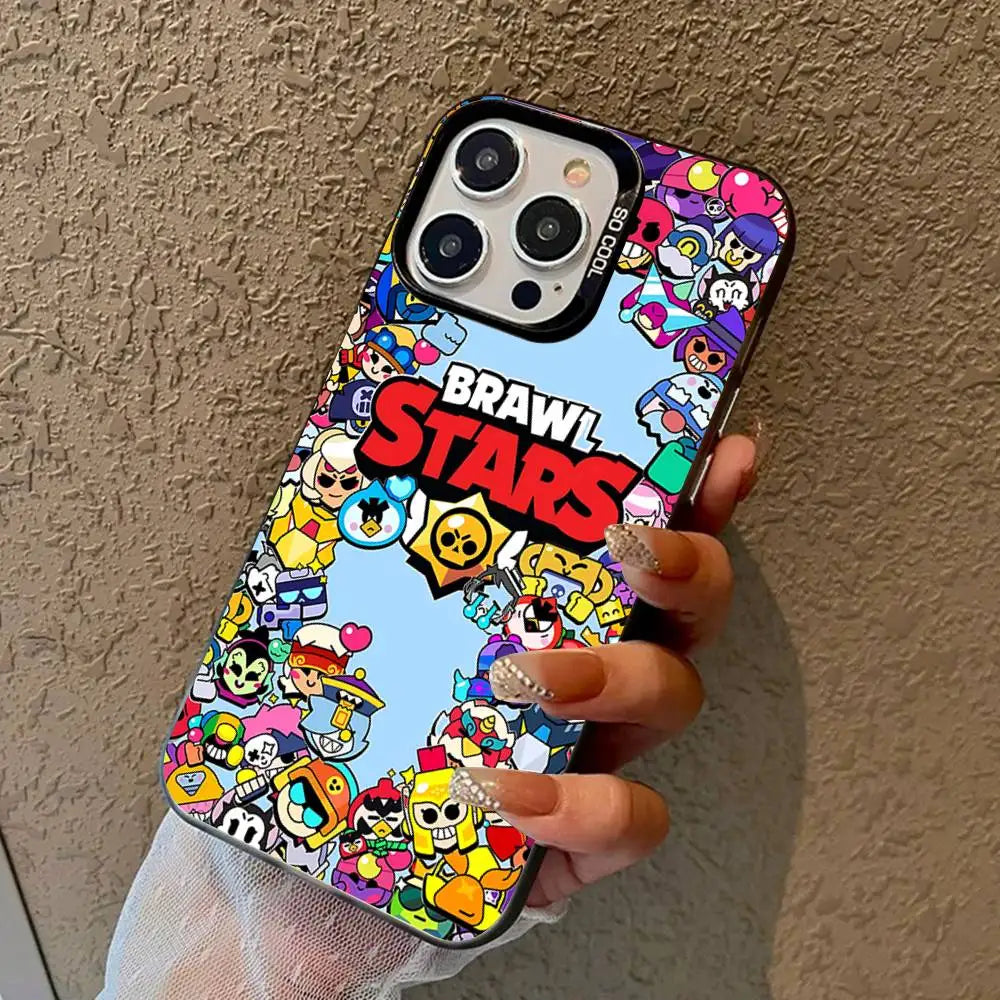 A hand holding a phone with a colorful Brawl Stars cartoon case against a textured beige wall.