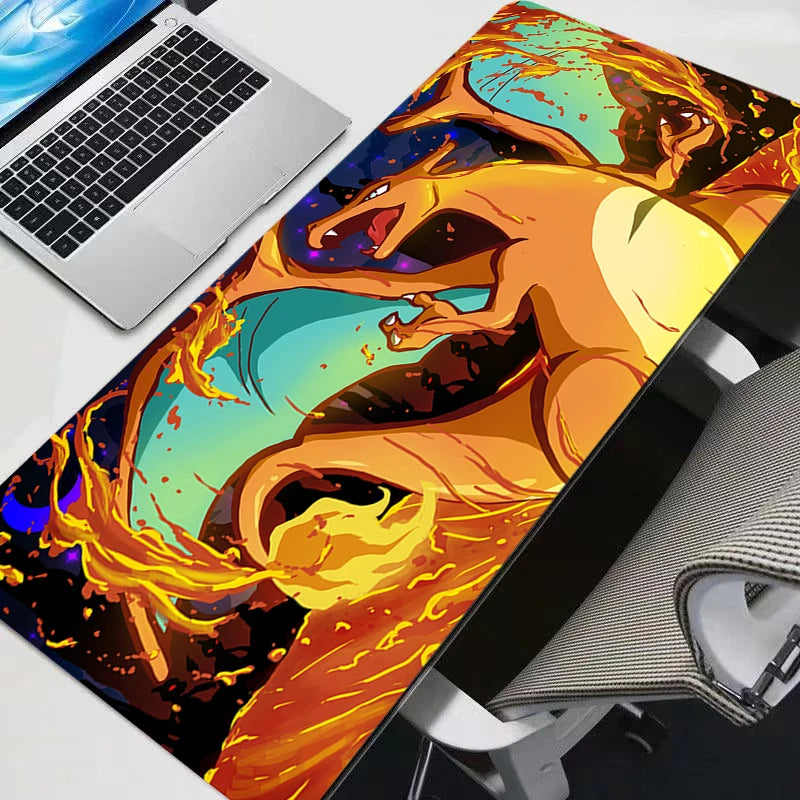 Colorful dragon design on a desk mat with a laptop and mouse.