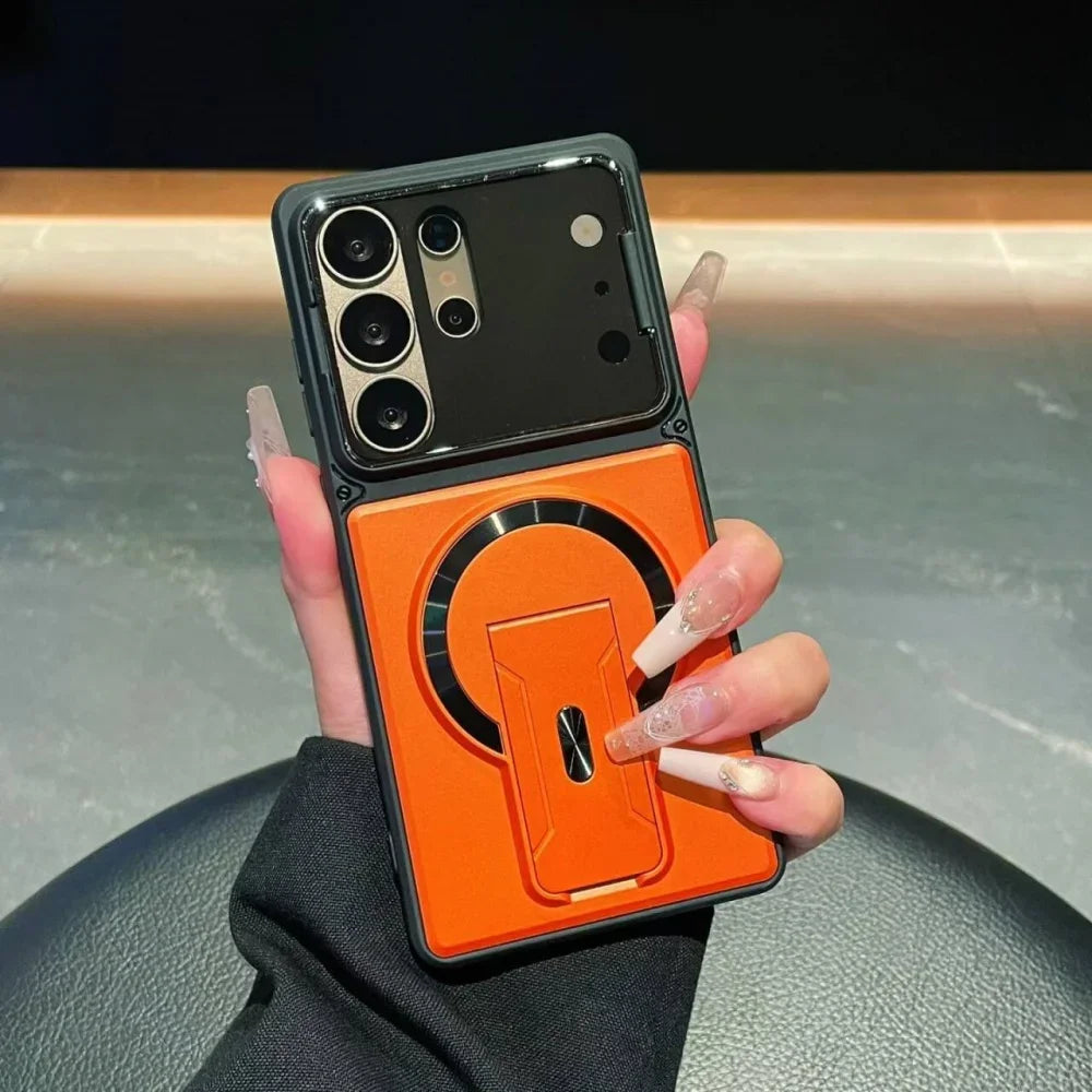 Phone case with orange back and black front held by a hand
