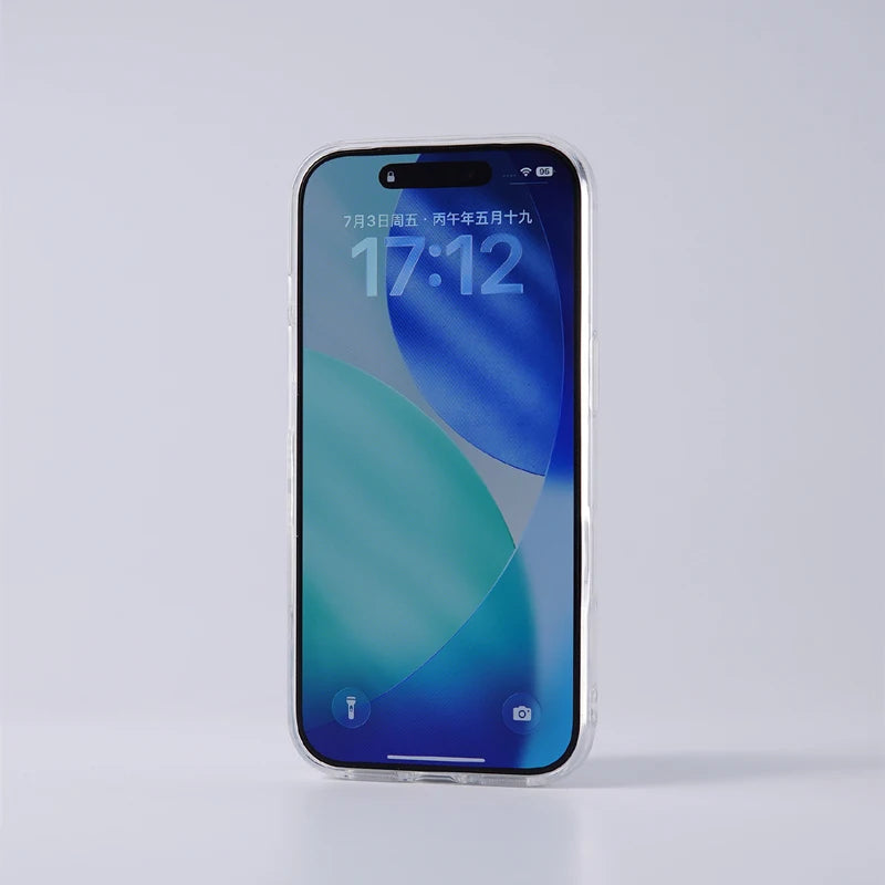 A clear protective bumper case fitted onto a silver-framed smartphone, standing upright on a light gray reflective surface.