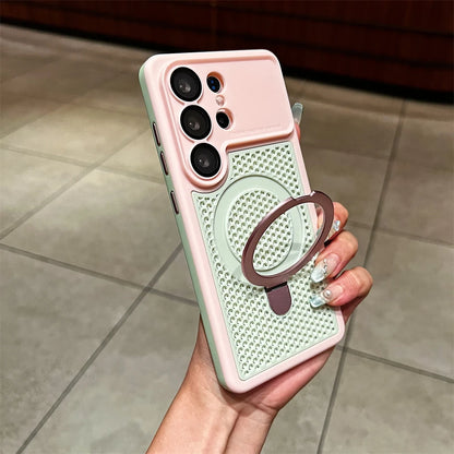 A hand holding a light pink and mint green phone case with a textured circular ring stand, shown against a tiled indoor background.