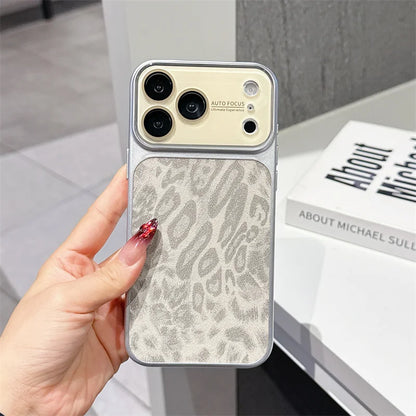 Phone case with leopard print pattern held by a hand