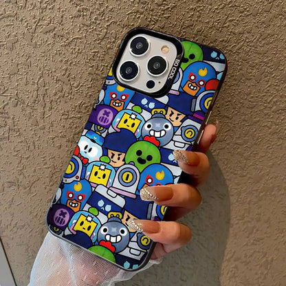A hand holding a phone case with a colorful cartoon character pattern against a textured beige wall.
