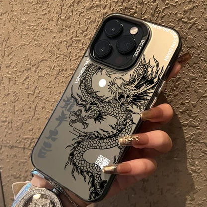 Phone case with dragon design held by a hand against a textured wall.