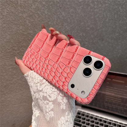 Pink textured phone case held by a hand with a blurred background