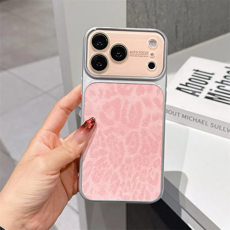 Phone case with pink textured back held by a hand