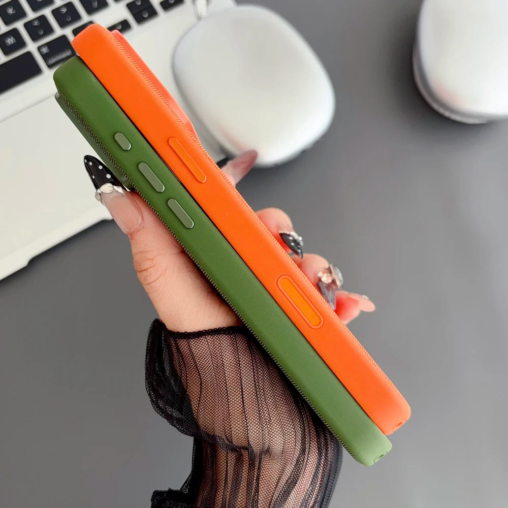 Hand holding a green and orange phone case with a blurred office background