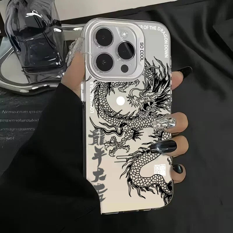 Phone case with dragon design held by a hand against a dark background
