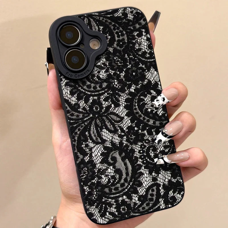 Phone case with black lace pattern held by a hand against a beige background