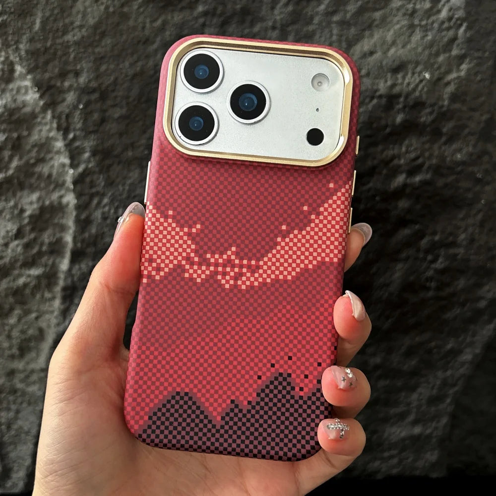 Hand holding a phone with a red pixelated case against a dark background