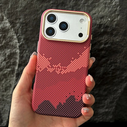 Hand holding a phone with a red pixelated case against a dark background
