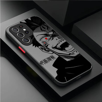 A black phone case featuring a bold black and white anime-style character illustration with a small red eye accent, shown on a dark gray smartphone. The case has a red accent button on the side and is photographed on a dark, modern geometric surface.