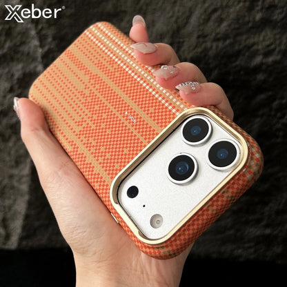 Hand holding a phone case with a textured orange pattern, brand 'Xeber' visible.