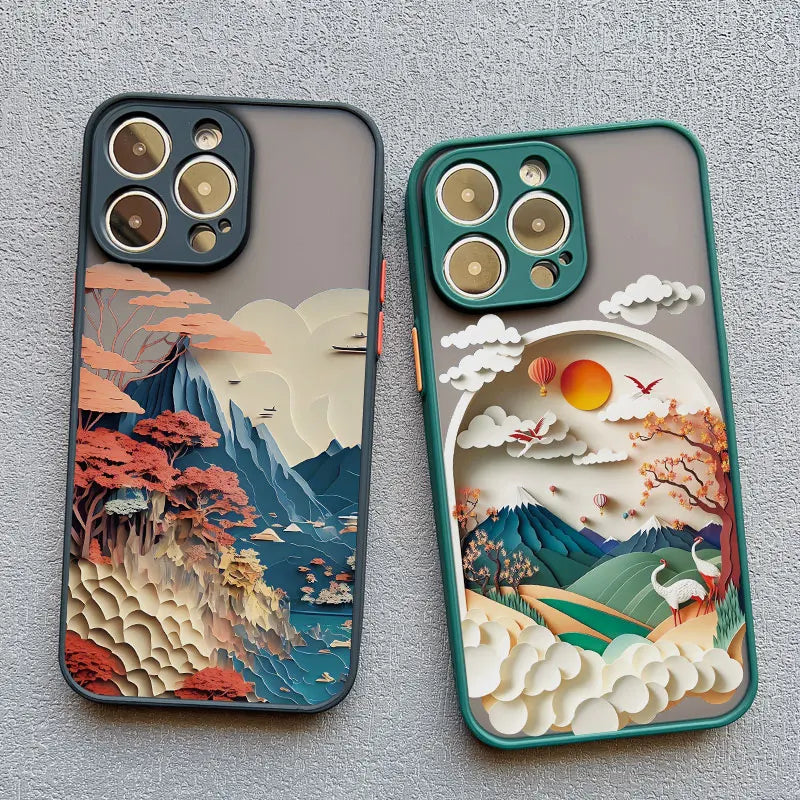 Two phone cases with artistic mountain and landscape designs on a gray background