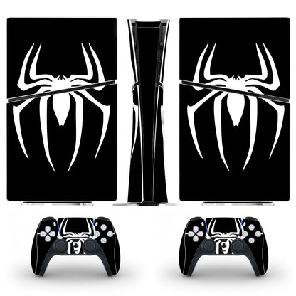 Gaming console and controllers with spider-themed decal on a white background