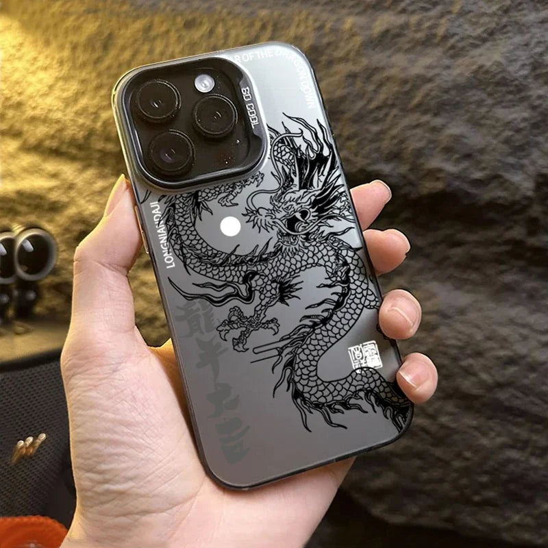 Phone case with dragon design held in a hand against a textured background