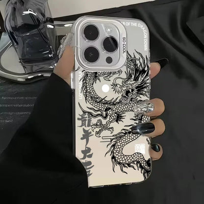 Phone case with dragon design held by a hand against a dark background