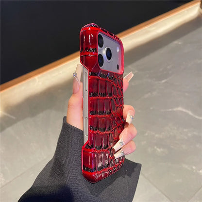 Red crocodile pattern phone case held by a hand on a neutral background