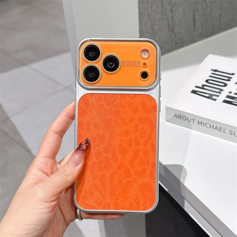 Orange phone case held by a hand with a blurred background