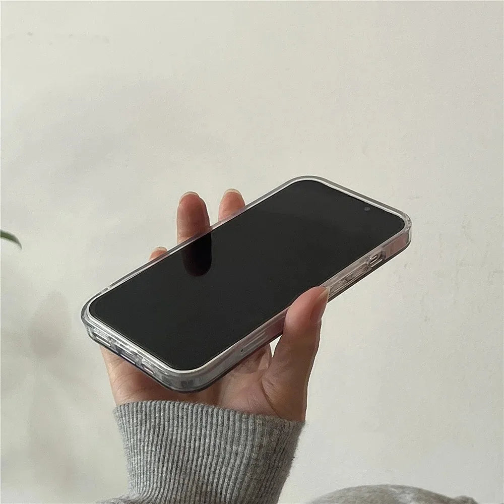 Hand holding a smartphone with a black screen against a plain background