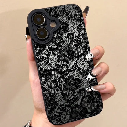 Phone case with black lace pattern held by a hand against a beige background