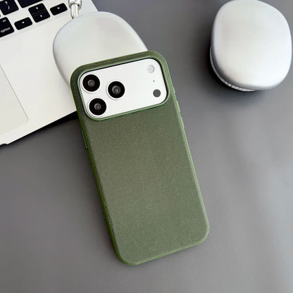 Green phone case on a gray surface with a laptop and mouse in the background