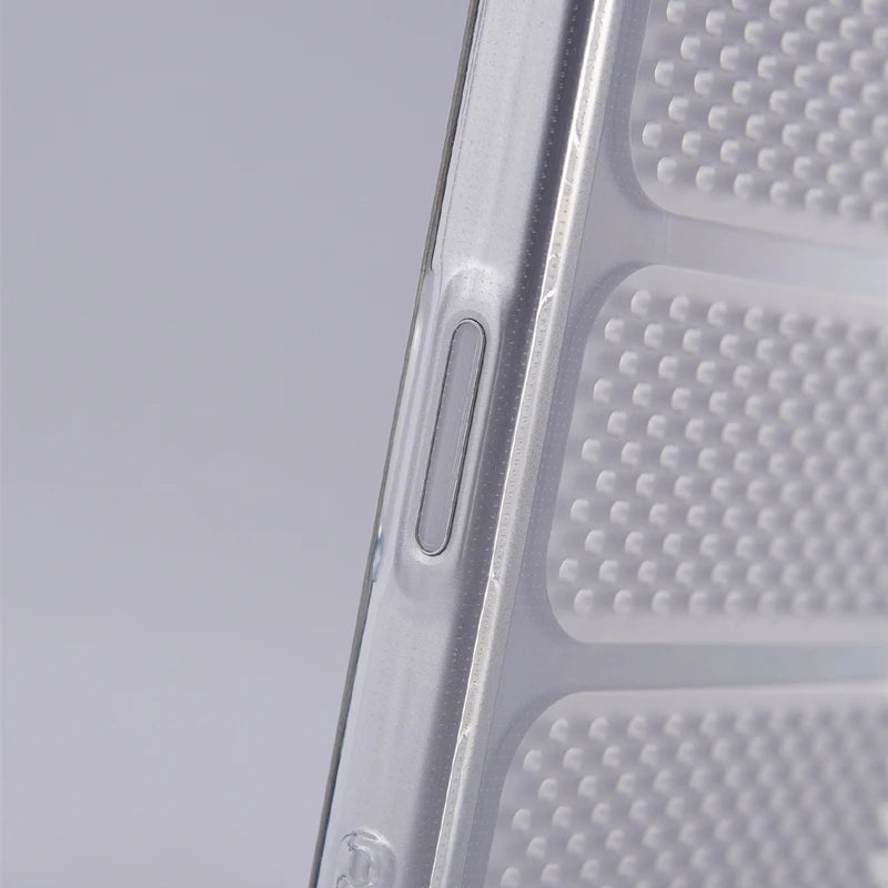 Close-up of a transparent phone case showing a side button cutout and textured bump details on a light gray background.