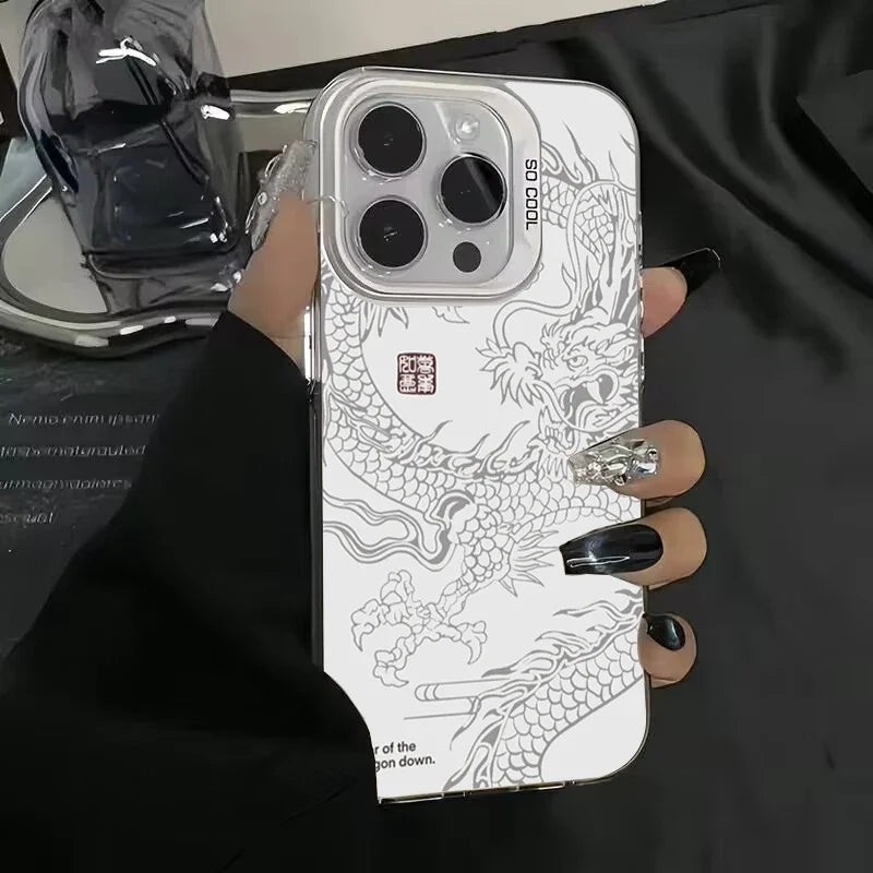Phone case with dragon design held by a person against a dark background