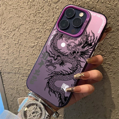 Phone case with dragon design held by a hand against a textured wall.